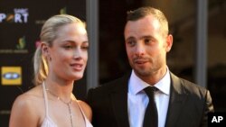 Oscar Pistorius might claim self defense against charges he murdered girlfriend Reeva Steenkamp (left) seen here with the sprinter at an awards ceremony in Johannesburg, South Africa, Nov. 4, 2012.