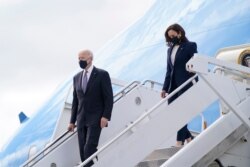 President Joe Biden and Vice President Kamala Harris steps off Air Force One, March 19, 2021, at Dobbins Air Reserve Base in Marietta, Ga.