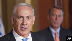 House Speaker John Boehner of Ohio looks on at right as Israeli Prime Minister Benjamin Netanyahu makes a statement on Capitol Hill in Washington, May 24, 2011