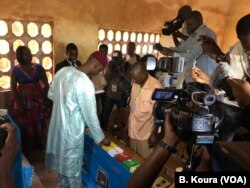 FILE - Opposition candidate Cabral Libii votes in Efoulan school, Yaounde third district.
