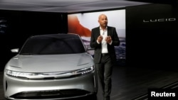FILE - Derek Jenkins, VP of Design at Lucid Motors, introduces the alpha prototype of the Lucid Air at the 2017 New York International Auto Show in New York City, April 13, 2017.