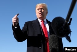FILE - President Donald Trump talks to reporters about journalist Jamal Khashoggi's disappearance prior to boarding Air Force One for travel to Montana from Joint Base Andrews, Md., Oct. 18, 2018.