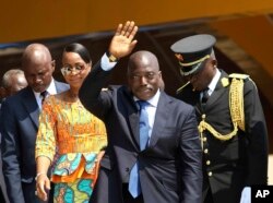 FILE - Congolese President Joseph Kabila, center, waves as he and others celebrate independence for the Democratic Republic of Congo in Kindu, Congo.