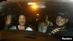FILE - Keiko, Sachi and Hiro Fujimori, daughters and son of former President Alberto Fujimori arrive to visit their father after Peruvian President Pedro Pablo Kuczynski pardoned him, at Centenario hospital in Lima, Peru, Dec. 24, 2017.