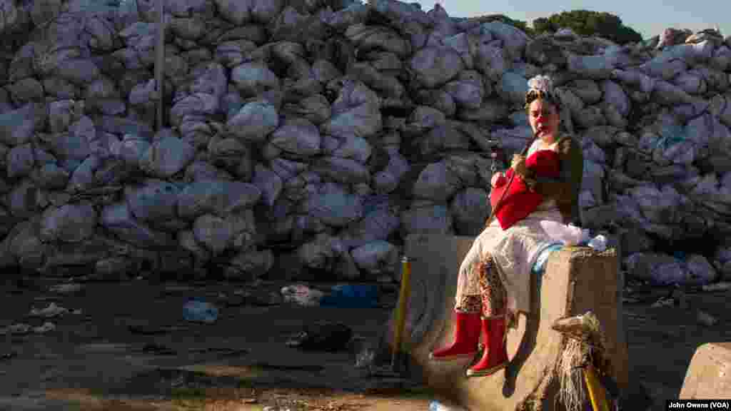 Clown Me In member Sara Berjawi, who goes by the clown name Ziza, prepares to film a Valentine's Day video that hopes to draw awareness to Lebanon's trash crisis, at a dump site on the outskirts of Beirut.