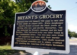 FILE - A Mississippi Freedom Trail marker recaps the significance of Bryant's Grocery and Meat Market, left, now in ruins, in Money, Miss., where in 1955, 14-year-old Emmett Till allegedly whistled, grabbed and made sexual advances to a white woman.
