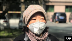 FILE - Chinese writer Fang Fang speaks with journalists in Wuhan, Hubei province, China, Feb. 22, 2020.