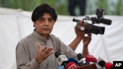 FILE - Pakistani Interior Minister Nisar Ali Khan speaks to reporters in Islamabad, Sept. 23, 2016. Following the abduction and killing of two Chinese nationals, Khan directed authorities to review the process of issuance of visas to Chinese nationals.