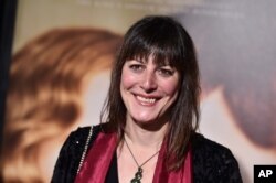 FILE - Rebecca Root arrives at the premiere of "The Danish Girl" at Regency Village Theatre in Los Angeles, Nov. 21, 2015.