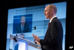 FILE - Carter Page, a former foreign policy adviser of U.S. President Donald Trump, speaks at a news conference at RIA Novosti news agency in Moscow, Russia, Dec. 12, 2016.