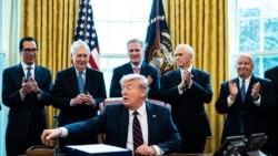 WASHINGTON, DC - MARCH 27: (L-R) Treasury Secretary Steven Mnuchin, Senate Majority Leader Mitch McConnell (R-KY), House Minority Leader Kevin McCarthy (R-CA), Vice President Mike Pence and Rep. Kevin Brady (R-TX) applaud U.S. President Donald Trump…