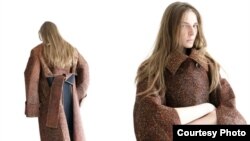 Model showcases a coat from Bobby Kolade's collectioni, featured at Berlin Fashion Week (Photo: William Minke)