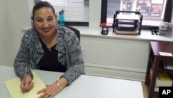 Esperanza Villalobos, a "community navigator," works at her office at The Resurrection Project in Chicago, Illinois, Dec. 16, 2016. Villalobos helps immigrants who might need legal services to avoid deportation or learn about their legal rights.