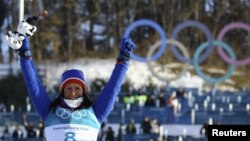 Gold medallist Marit Bjoergen of Norway celebrates on the podium after winning the gold medal in the women's 30k cross-country skiing competition at the 2018 Winter Olympics in Pyeongchang, South Korea, Feb. 25, 2018. Bjoergen won five medals at the Pyeongchange Games.