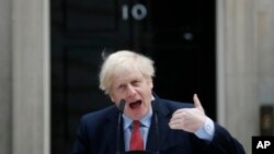 British Prime Minister Boris Johnson makes a statement on his first day back at work in Downing Street, London, after recovering from a bout with the coronavirus that put him in intensive care, Monday, April 27, 2020. The highly contagious COVID-19…