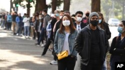 People queue to receive a vaccination at the NSW Vaccine Centre at Homebush Olympic Park in Sydney, Australia, July 1, 2021. 