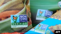 FILE - Labels on bags of snack foods indicate they are non-GMO products, Los Angeles, California, Oct. 19, 2012. 