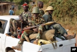 FILE - Seleka rebels are seen driving through Bangui, Central African Republic, Jan. 27, 2014.