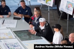 President Donald J. Trump and First Lady Melania Trump, joined by Texas Governor Greg Abbott, FEMA Administrator William “Brock” Long and representatives of the Red Cross, U.S. Coast Guard, local law enforcement and utility company officials, attend a briefing on Hurricane Harvey relief and rescue efforts, Tuesday, August 29, 2017, in Corpus Christi, Texas.
