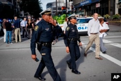 Emergency personnel and police respond to a reported active shooter situation near Fountain Square, Sept. 6, 2018, in downtown Cincinnati, Ohio.