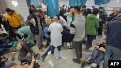 FILE - Victims are treated inside the Kamal Adwan Hospital in Beit Lahiya in the northern Gaza Strip, following Israeli strikes around the medical complex on Dec. 6, 2024.