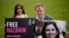 Richard Ratcliffe, suami dari Nazanin Zaghari-Ratcliffe, warga Inggris keturunan Iran yang ditahan di Iran, bersama anaknya Gabriella berpose untuk media dengan membawa foto sang istri, di London, Inggris, pada 23 September 2021. (Foto: AP/Matt Dunham)