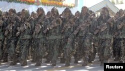 Members of the Iranian Army march during a parade, in Tehran, Sept. 22, 2015.