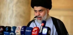 FILE - Iraqi Shi'ite cleric Muqtada al-Sadr delivers a sermon to worshippers at the Kufa mosque near Najaf, Iraq, June 5, 2019.