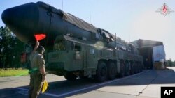In this photo taken from video released by Russian Defense Ministry Press Service on Sept. 17, 2024, a Russian RS-24 Yars strategic ballistic missile launcher moves out of a hangar during a drills in Ivanovo region, Russia.
