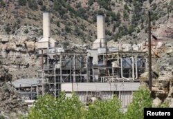 FILE - The coal-fired Castle Gate Power Plant sits idle outside Helper, Utah, Aug. 3, 2015. The plant was closed in April 2015 in anticipation of new EPA regulations. Former President Barack Obama's Clean Power Plan sought to to tackle greenhouse gases from coal-fired power plants.