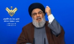 FILE - The leader of the Lebanese Shiite party, Hassan Nasrallah, delivers a televised speech from an undisclosed location, in this image grab taken from Hezbollah's al-Manar TV on June 8, 2021.