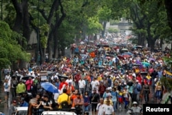 Demonstrators rally against Venezuela's President Nicolas Maduro in Caracas, Venezuela, April 13, 2017.