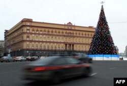 Cars drive past the headquarters of the FSB security service, the successor to the KGB in central Moscow on December 30, 2016.