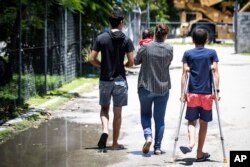 FILE - Refugees are pictured on Nauru, Sept. 4, 2018. Psychiatric and physical suffering of children has been the major criticism of the government’s policy since 2013 to send asylum seekers who attempt to reach Australia by boat to an immigration camp on Nauru or men-only facilities on Papua New Guinea.