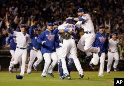 Chicago Cubs players celebrate after Game 6 of the Major League Baseball championship series against the Los Angeles Dodgers at Wrigley Field Stadium, Chicago, Illinois, Oct. 22, 2016.