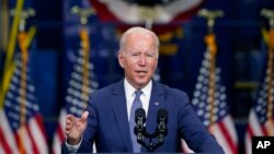 FILE - President Joe Biden delivers remarks at NJ Transit Meadowlands Maintenance Complex to promote his "Build Back Better" agenda, in Kearny, N.J., Oct. 25, 2021.