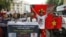 Anti-China protesters hold Vietnamese national flags and anti-China banners while marching on a street in Hanoi, December 9, 2012. 