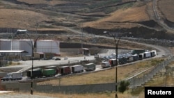 Trucks are seen at Haj Omran border, on the border between Iran and Kurdistan, Iraq, Oct. 14, 2017. 