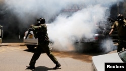 Policemen fire tear gas to disperse opposition supporters protesting against the retention of the election officials they blame for last month's botched elections, in Nairobi, Oct. 2, 2017. 