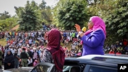 Tanzanian Vice President Samia Suluhu Hassan, right, speaks during a tour of the Tanga region of Tanzania, March 16, 2021.
