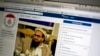 FILE - A photo shows a Facebook site that features Hafiz Saeed, founder of Lashkar-e-Taiba, a banned organization and a U.S.-declared terrorist group, in Islamabad, Pakistan, July 7, 2017. A senior Pakistani government official said at the time that more than 40 of 65 organizations banned in Pakistan operated flourishing social media sites.
