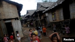 FILE - Ethnic Karen refugee children from Myanmar pass the time at the Mae La camp outside Mae Sot near the Thai-Myanmar border, Oct. 14, 2010.
