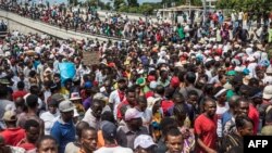Demonstrators take part in a protest demanding the resignation of President Jovenel Moise in the Haitian capital in Port-au-Prince, Oct. 20, 2019. 
