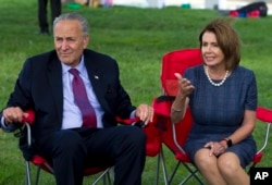 House Minority Leader Nancy Pelosi of California, accompanied by Senate Minority Leader Chuck Schumer of New York, speaks with DREAMERS who are holding a four-day fast on Capitol Hill in Washington, Sept. 7, 2017.