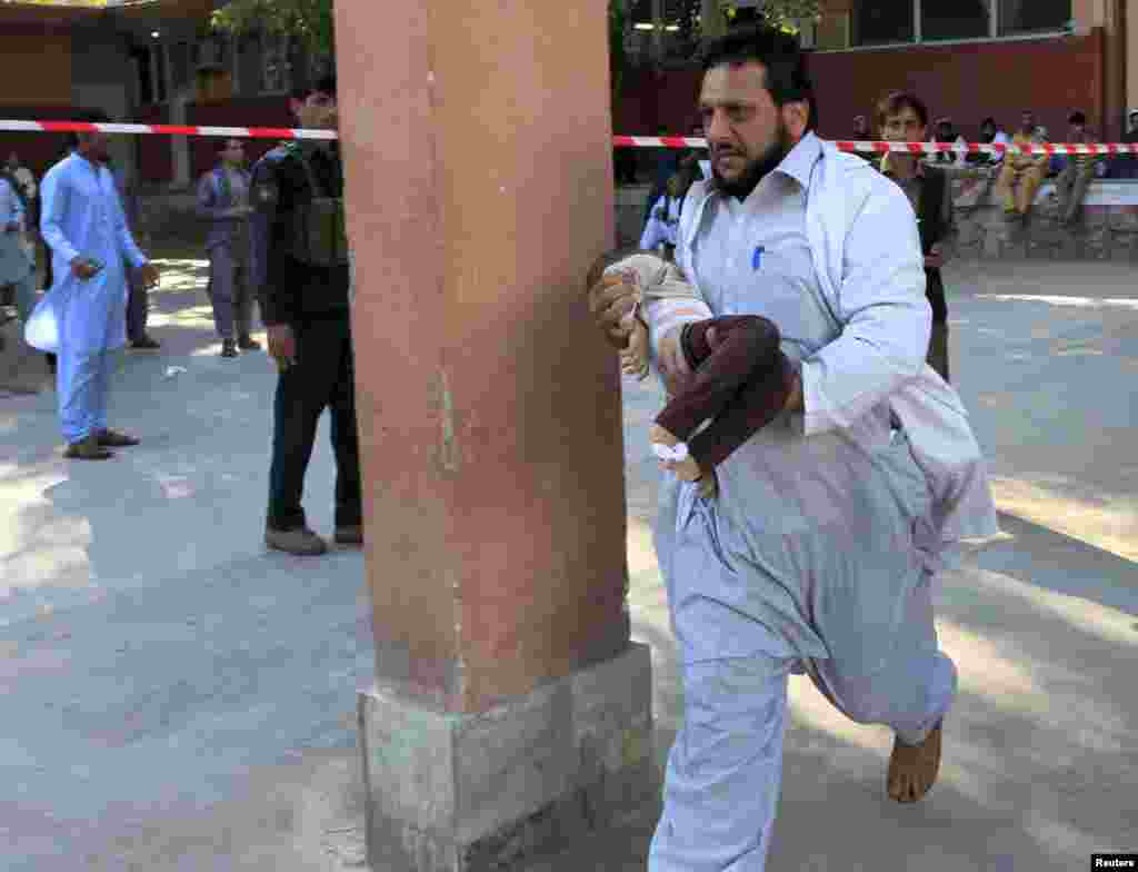 A rescue worker carries a child who was injured during an earthquake, at a hospital in Jalalabad, Afghanistan. A powerful earthquake struck a remote area of northeastern Afghanistan, shaking the capital Kabul, as shockwaves were felt in northern India and in Pakistan&#39;s capital, where hundreds of people ran out of buildings as the ground rolled beneath them.