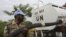 A United Nations peacekeepers soldier prepare to distribute water to the population of Tai, (Ivory Coast) near the border with Liberia, June 18, 2012.
