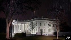 FILE - In this photo, a light rain falls outside the White House in Washington, Jan. 28, 2022. 