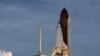 US Astronauts Inspecting Shuttle for Damage