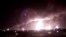 Fires burn in the distance after a drone strike by Yemen's Iran-aligned Houthi group on Saudi company Aramco's 