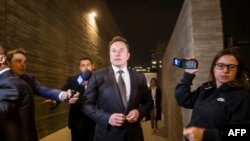 Elon Musk leaves the U.S. District Court, Central District of California through a back door in Los Angeles, Dec. 3, 2019. The defamation lawsuit against the Tesla CEO began over calling British cave explorer Vernon Unsworth "Pedo Guy" and child rapist.